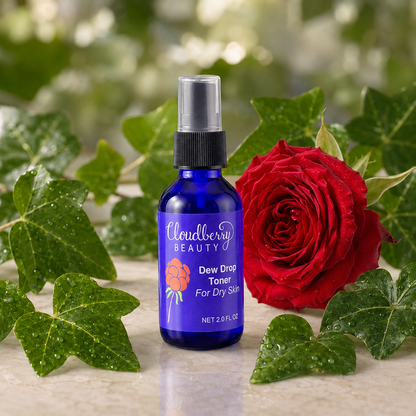 Cloudberry Beauty Dew Drop Toner for Dry Skin styled with a red rose and water-dappled ivy leaves.