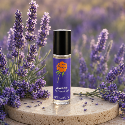 Cloudberry Beauty Lavender Perfume Oil roll-on bottle displayed among blooming lavender.
