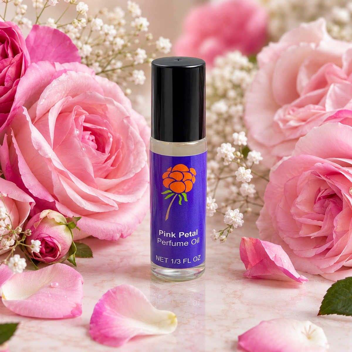 Cloudberry Beauty Pink Petal Perfume Oil roll-on bottle surrounded by lush pink roses and petals.